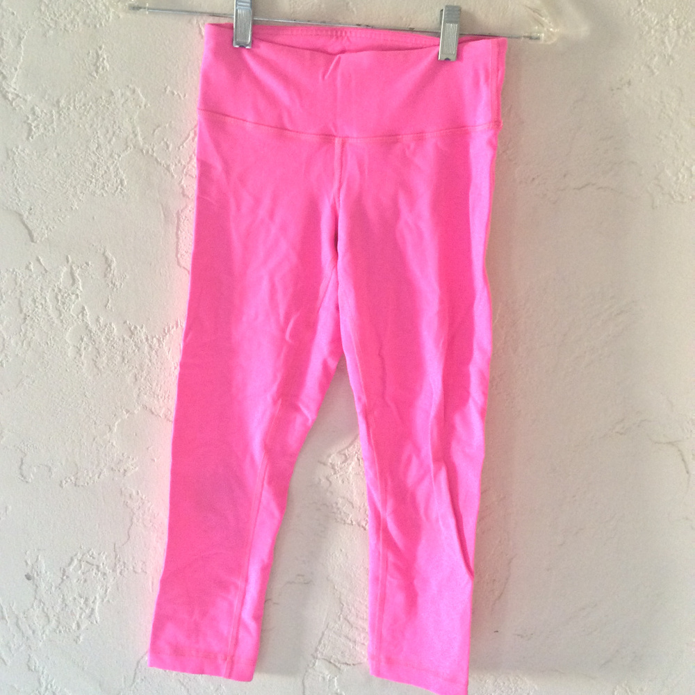 Neon pink Lululemon crop leggings